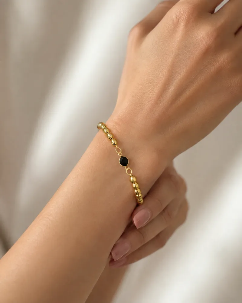 Pulseira de Bolinhas Dourada com Bola Preta