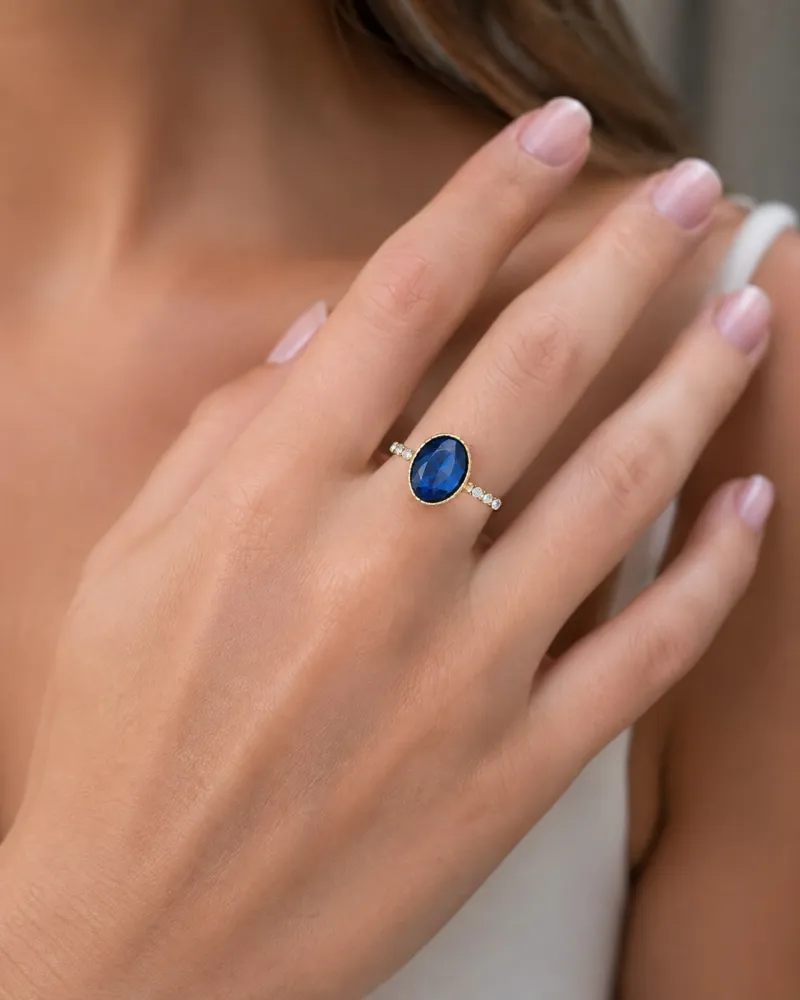 Anel Dourado Pedra Oval Azul Marinho Bijuteria ( TAM 17 )